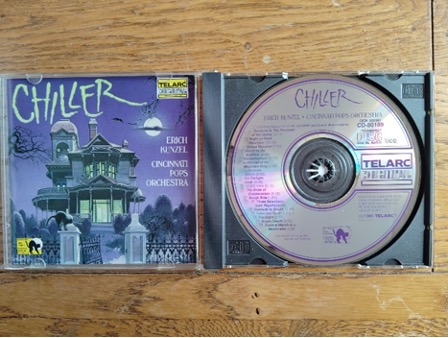 A cd case on a tableAI-generated content may be incorrect.